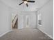 This bedroom offers neutral walls, plush carpeting, and ample natural light for a relaxing space at 908 Sundance Dr, Gastonia, NC 28054