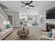 Open-concept living area boasts sleek floors, a fireplace, and seamless transitions to the kitchen and dining spaces at 908 Sundance Dr, Gastonia, NC 28054