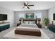 The main bedroom features ample natural light, neutral walls, a ceiling fan, and an elegant accent wall at 908 Sundance Dr, Gastonia, NC 28054