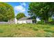 Landscaped backyard with a screened-in porch, perfect for enjoying the outdoors in comfort at 9711 Castle Terrace Ct, Charlotte, NC 28215