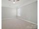 Neutral bedroom featuring carpet, crown molding, and bright natural light at 9711 Castle Terrace Ct, Charlotte, NC 28215