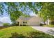 Charming home featuring a manicured front lawn and an attached two-car garage at 9711 Castle Terrace Ct, Charlotte, NC 28215