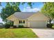 Charming home featuring a manicured front lawn and an attached two-car garage at 9711 Castle Terrace Ct, Charlotte, NC 28215