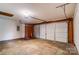 Spacious garage featuring a large, multi-panel door, offering ample storage and parking space for vehicles at 9711 Castle Terrace Ct, Charlotte, NC 28215
