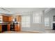 View of the kitchen and dining area, showing the layout and connections between the rooms at 9711 Castle Terrace Ct, Charlotte, NC 28215