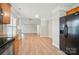 Open floor plan showcasing the living room, seamlessly connected to the kitchen with modern appliances at 9711 Castle Terrace Ct, Charlotte, NC 28215