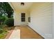 Covered patio showcasing a cozy outdoor space with brick-lined flooring at 9711 Castle Terrace Ct, Charlotte, NC 28215