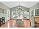 Sun-filled dining area with a large window, white table, and seating, perfect for Gathering gatherings at 1031 Butterburr Dr, Matthews, NC 28104