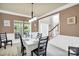 Charming dining room featuring large windows, elegant decor, and ample natural light at 1031 Butterburr Dr, Matthews, NC 28104