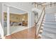 Grand foyer featuring hardwood floors, staircase, and elegant architectural columns at 1031 Butterburr Dr, Matthews, NC 28104