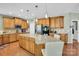 Charming kitchen with granite countertops, wooden cabinets, and stainless steel appliances at 1031 Butterburr Dr, Matthews, NC 28104