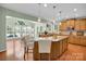 Spacious kitchen featuring an island, wood cabinets, and stainless steel appliances at 1031 Butterburr Dr, Matthews, NC 28104