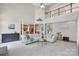 Open concept living room with view of kitchen and upper level at 1031 Butterburr Dr, Matthews, NC 28104