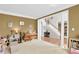 Cozy living room with classic columns, ample seating, and inviting ambiance at 1031 Butterburr Dr, Matthews, NC 28104