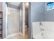 Cozy bathroom featuring shower, soaking tub, and neutral colored walls at 108 Copes Ct, Rock Hill, SC 29732