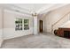 Formal dining room showcases natural light, chandelier, and access to the foyer at 108 Copes Ct, Rock Hill, SC 29732