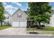 Charming home featuring a two-car garage, manicured lawn, and inviting front porch at 108 Copes Ct, Rock Hill, SC 29732
