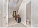 Inviting foyer with tile flooring, staircase, and decorative lighting creating a warm and welcoming atmosphere at 108 Copes Ct, Rock Hill, SC 29732