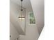 Brightly lit hallway with a decorative pendant light and a window at 108 Copes Ct, Rock Hill, SC 29732