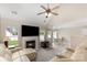 Open-concept living area with fireplace, vaulted ceilings, and a large sectional sofa, ideal for entertaining at 108 Copes Ct, Rock Hill, SC 29732