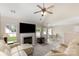 Open-concept living area with fireplace, vaulted ceilings, and a large sectional sofa, ideal for entertaining at 108 Copes Ct, Rock Hill, SC 29732