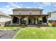 A spacious backyard offers a covered deck and lush landscaping at 11109 Amur Ct, Charlotte, NC 28262