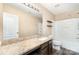 Well-lit bathroom features granite countertops, vanity lighting, tile flooring, and shower-tub combo at 11109 Amur Ct, Charlotte, NC 28262