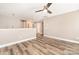 Bright bonus room with wood flooring, ceiling fan, and neutral walls, ideal for versatile living at 11109 Amur Ct, Charlotte, NC 28262