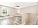 Light, bright bonus room features a ceiling fan, beautiful floors, and a charming window seat at 11109 Amur Ct, Charlotte, NC 28262