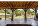 Covered patio featuring an open view of a fenced backyard with a playset at 11109 Amur Ct, Charlotte, NC 28262