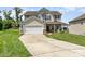 Attractive two-story home boasting a two-car garage, a welcoming front porch, and well-kept landscaping at 11109 Amur Ct, Charlotte, NC 28262