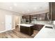 Modern kitchen featuring stainless steel appliances, a kitchen island and dark cabinetry at 11109 Amur Ct, Charlotte, NC 28262