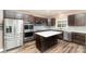 Modern kitchen with stainless steel appliances, ample counter space, and a functional center island at 11109 Amur Ct, Charlotte, NC 28262
