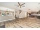 Open-concept living space with wood flooring, natural light, and seamless flow to the kitchen and staircase at 11109 Amur Ct, Charlotte, NC 28262