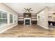 Cozy living room with fireplace, custom built-ins, and hardwood floors at 11109 Amur Ct, Charlotte, NC 28262