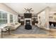 Inviting living room features a fireplace, modern furniture, and an open layout, perfect for relaxation and entertainment at 11109 Amur Ct, Charlotte, NC 28262