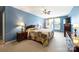 Bright and airy bedroom with a colorful quilt, wooden furniture, plush carpet, and abundant natural light at 1117 Yarrow St, Matthews, NC 28104