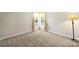 Bright, vacant bedroom with plush carpeting, natural light from a large window, and neutral walls at 1117 Yarrow St, Matthews, NC 28104