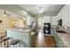 Charming kitchen featuring green and white cabinetry, stainless steel appliances, and a breakfast bar with seating at 1117 Yarrow St, Matthews, NC 28104