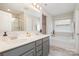 Modern bathroom with dual sinks, a vanity, and a separate soaking tub at 1121 Freeman View Dr, Albemarle, NC 28001