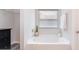 Bright bathroom featuring a large soaking tub, white vanity, and a window for natural light at 1121 Freeman View Dr, Albemarle, NC 28001