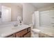 Well-lit bathroom with a double vanity and separate tub/shower at 1121 Freeman View Dr, Albemarle, NC 28001