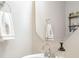 Clean and simple bathroom with a pedestal sink, decorative towels, and a mirror at 1121 Freeman View Dr, Albemarle, NC 28001