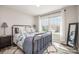 Bright bedroom with a large window, iron bed frame, and plush rug at 1121 Freeman View Dr, Albemarle, NC 28001