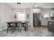 Dining area with a large wooden table that flows seamlessly into an updated kitchen at 1121 Freeman View Dr, Albemarle, NC 28001