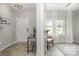 Welcoming entryway featuring wood floors, a console table, and a glimpse into the living room at 1121 Freeman View Dr, Albemarle, NC 28001