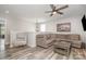 Cozy living room with a sectional sofa, modern ceiling fan, and stylish decor at 1121 Freeman View Dr, Albemarle, NC 28001