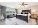 Spacious main bedroom featuring a ceiling fan, large bed, and serene views at 1121 Freeman View Dr, Albemarle, NC 28001