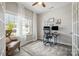 Bright and airy office with large windows, brick accent wall, and comfortable seating at 1121 Freeman View Dr, Albemarle, NC 28001