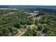 Aerial view of the property with a small house nestled in a wooded area at 1154 Stringfellow Rd, Chester, SC 29706